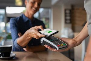 Customer paying contactless with phone